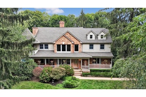 Beautiful Custom Built Home, situated on a park like fully gated property, with an in ground pool, pond, fountain and playground.