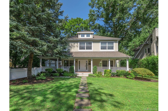 View of front of house featuring a porch and a shingled roof