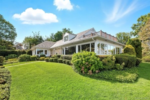 Nestled in the heart of The Manor, this easy living home offers water views of Larchmont Harbor and a rare.
