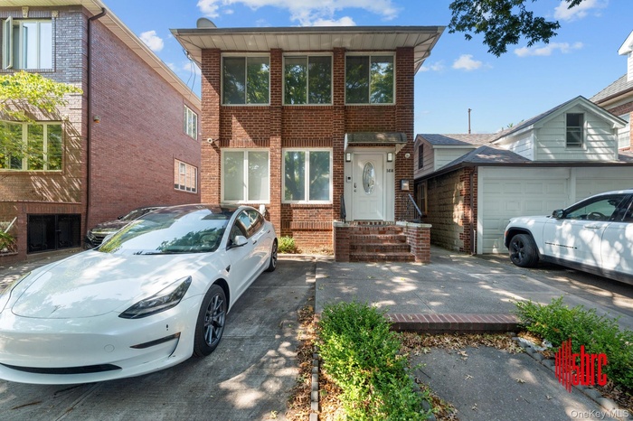 View of front of home featuring brick siding