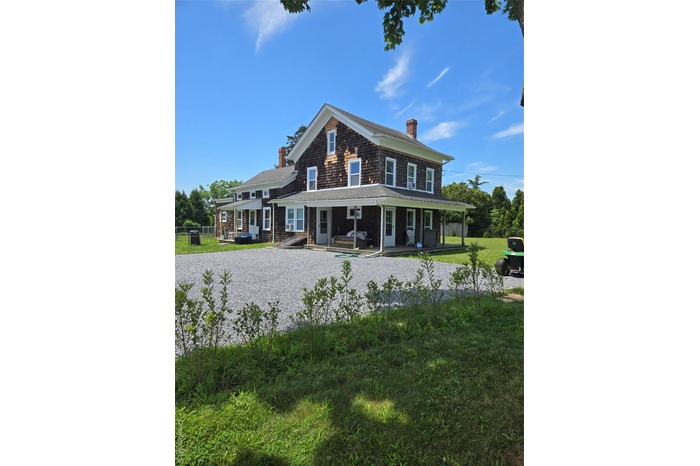 Rear view of house with a chimney