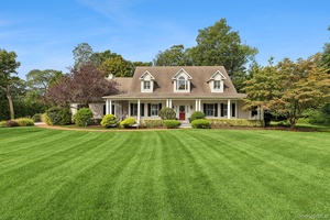 Welcome to 230 Willis Creek Drive, a rare waterfront retreat in one of Mattituck s most sought after luxury neighborhoods, Harbor Farms.