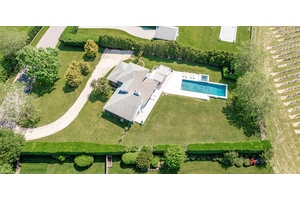 Water Mill Vineyard Retreat with Stunning Views Overlooking a picturesque vineyard, this contemporary home offers a seamless blend of style, comfort, and outdoor living.