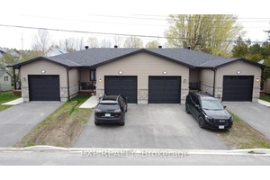 Attention investors ! ! Rarely offered purpose built Fourplex in Spencerville featuring four individually titled 2 bed, 1.
