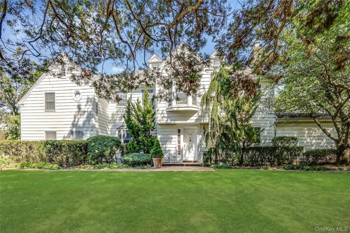 View of front of property with a front yard