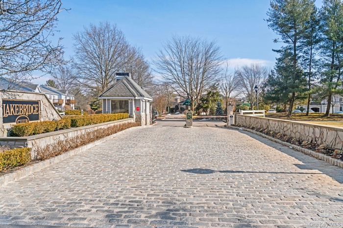 Tucked away with an elegant cobblestone entry gate