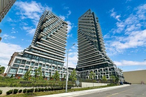 Experience luxury living at Auberge on the Park with this spacious 1 1 den, 2 bathroom garden facing unit, offering approximately 700 sqft of beautifully designed space.