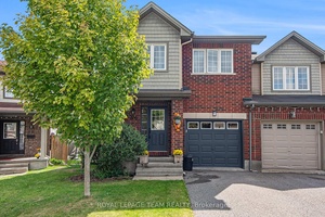 End unit townhome featuring hardwood floors on both levels.