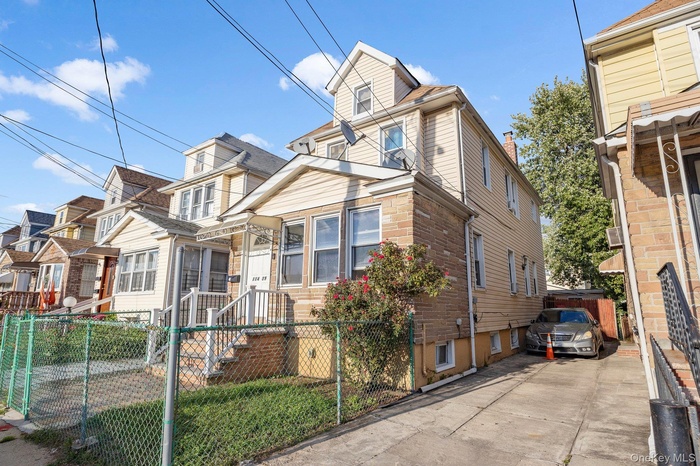 View of front of property with a fenced front yard