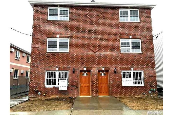 View of front of property with brick siding