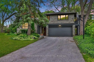 Architecturally significant family residence nestled at the end of a cul de sac on a gorgeous pie shaped lot abutting the park.