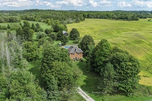 Located on a quiet rural country road, in a fantastic Southerly location close to town, this charming 4 bedroom, red brick Century home stately sits on 4.