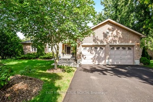 Discover the charm of Snow Valley with this stunning all brick bungalow, where nature, comfort, and style come together.