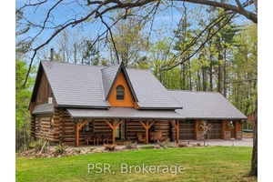 Welcome to this truly exceptional, custom built log home, lovingly maintained by its owners.