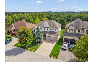 Tucked away within the quiet cul de sac of Credit Springs Estates, this Berkshire built residence offers refined living on a mature lot backing onto conservation with a sun drenched ...