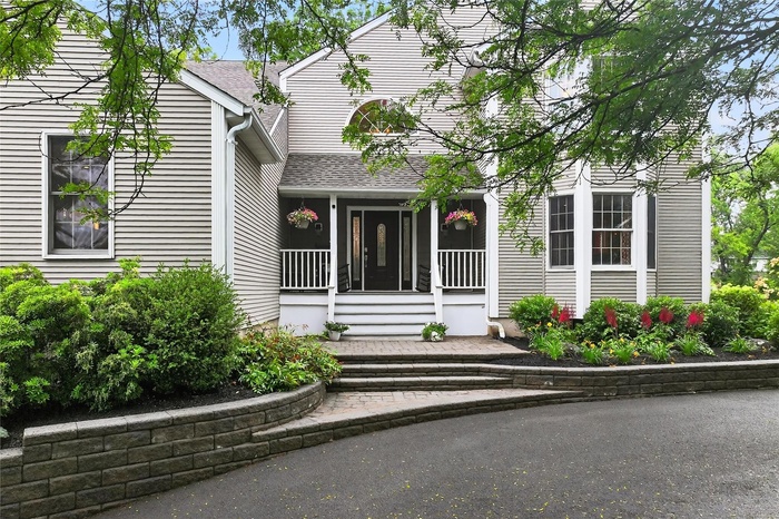 Property entrance with a shingled roof