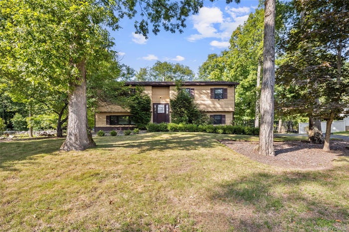 View of front of property with a front yard