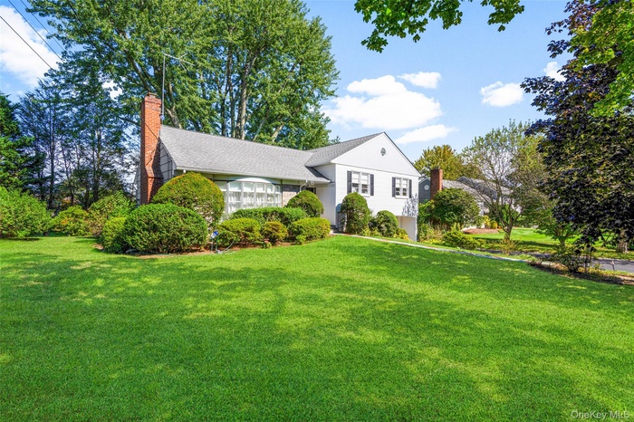 Located in desirable neighborhood, house is nicely sited on 0.25 acre lot with compelling deep setback from street.