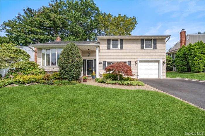 Gorgeous curb appeal, one car garage and four car driveway