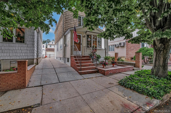 View of front of house featuring an outdoor structure