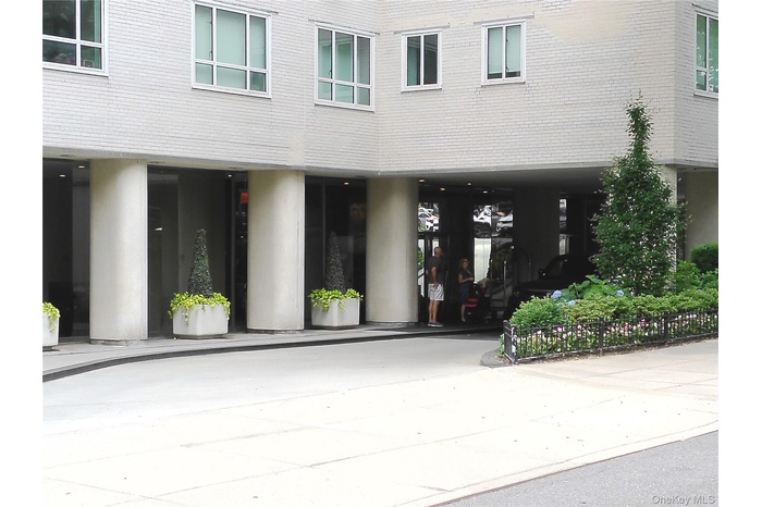 View of exterior entry with brick siding