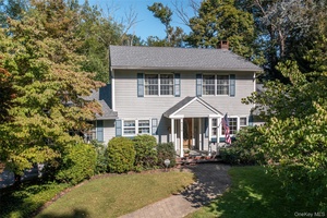 This charming colonial style home, built in 1970s, is nestled in the heart of Pleasant Valley, exuding timeless elegance and classic appeal.