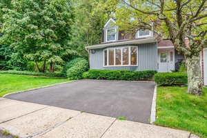 Beautifully updated and maintained Cedarwood Model, End Unit, located within the sought after Syosset School District.