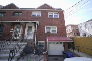 Welcome to this beautifully maintained brick 2 family home in the heart of Morris Park !