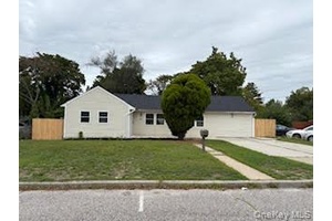 Come see this beautifully renovated Wideline Expanded Ranch located in the Central Islip School District, just a few blocks from the LIRR Station.