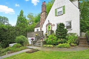 A MUST SEE charming storybook Village Tudor in prime location with close proximity to train, school, park, and town.