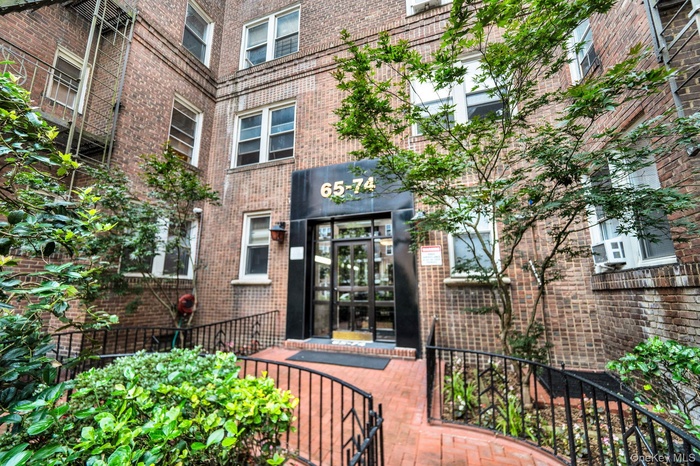 Entrance to property with brick siding