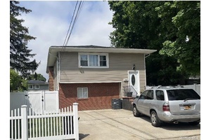 Beautiful Large meticulously kept 6 bedroom, 2 bathroom High Ranch in Westbury, Features Hardwood throughout, Spacious Living Room, Formal Dining Room, Family Room, Private 2 Car Driveway, huge Fenced in ...