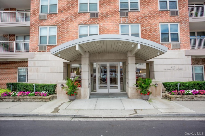 Entrance to property featuring brick siding
