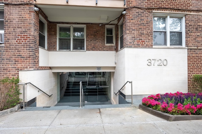 View of exterior entry featuring brick siding