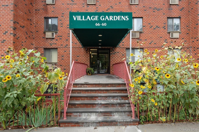 Entrance to property with brick siding