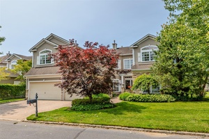 Tremendous Postmodern Home on 8th Green of The Gated Hamlet Golf Course with 3 floor Elevator.