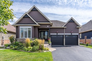 EXECUTIVE BUNGALOW located in a private neighbourhood of luxury homes, surrounded by nature and walking trails.