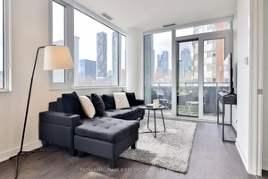 Welcome to this Bright and Inviting 805 Square Foot South West Facing Corner Unit at the Prestigious Time and Space Condos.