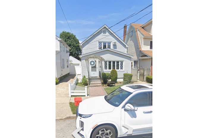 View of front of property featuring a gate