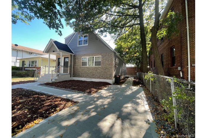 Bungalow-style home with stone siding
