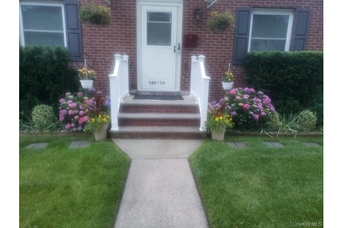 Property entrance featuring brick siding