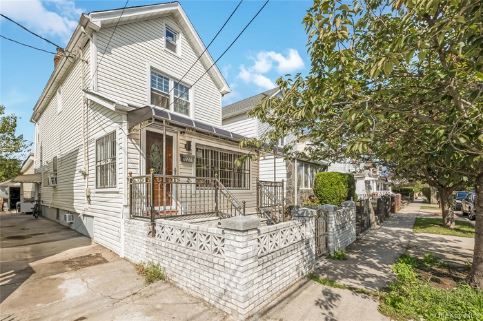 View of side of home with a fenced front yard