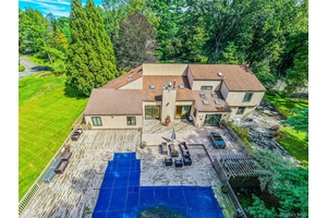 Welcome to 2 Summerwind Drive, a truly exceptional estate that combines luxury, comfort, and resort style living on 2 private acres.