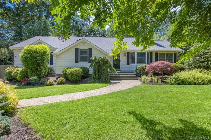 Single story home with roof with shingles and a front yard