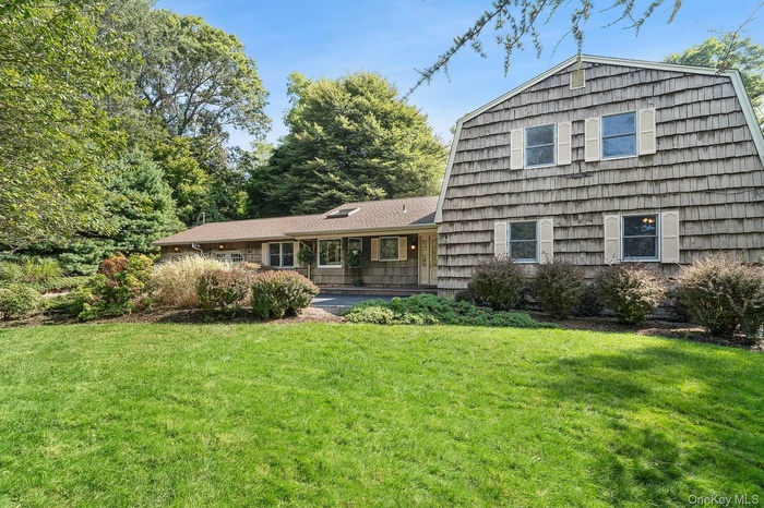 View of front of property with a front lawn