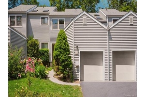 Welcome to 14 Bridle Path Road, a condominium with incredible potential in Ossining's sought after Fox Hill complex.