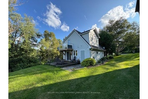 A private oasis on 4 acres of land, bordering a small lake.
