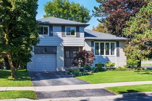 Welcome to this impeccably maintained 4 level sidesplit is nestled on a mature, tree lined lot backing directly onto Memorial Park, offering a perfect blend of privacy, tranquility, and convenience.