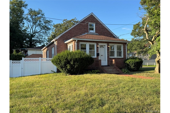 Bungalow-style home featuring brick siding