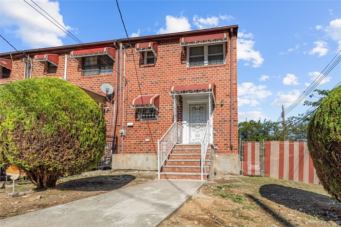 View of front of property featuring brick siding